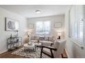 Cozy living room with neutral décor, a patterned rug, and bright natural light at 7275 E 8Th Ave, Denver, CO 80220