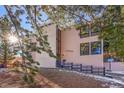 Attractive mid-century modern building with landscaping and a sunny view at 13682 W Virginia Dr, Lakewood, CO 80228