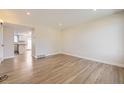 Bright living room featuring hardwood floors, fresh paint, and recessed lighting at 610 S Xenon Ct, Lakewood, CO 80228