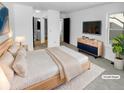 A stylish main bedroom with an ensuite bathroom and modern furnishings for a relaxing retreat at 2639 S Xanadu Way # B, Aurora, CO 80014