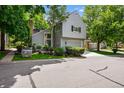 Charming two-story home with a gray exterior, well-manicured landscaping, and an attached two-car garage at 4505 S Yosemite St # 125, Denver, CO 80237