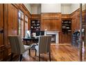 Spacious home office with built-in shelving and hardwood floors at 2198 Avenida Del Sol, Castle Rock, CO 80104