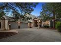 Charming home featuring a three-car garage, brick facade, and well-manicured landscaping at 2187 Wynterbrook Dr, Highlands Ranch, CO 80126