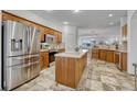 Spacious kitchen featuring stainless steel appliances and an island at 23480 E Moraine Pl, Aurora, CO 80016