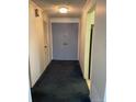 View of the hallway leading to the apartment with double doors at 3131 E Alameda Ave # 604, Denver, CO 80209