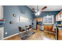 Eat-in kitchen with stainless steel appliances and blue walls at 4396 Dearborn St, Denver, CO 80239