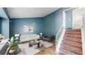 Inviting living room with stylish decor and a staircase at 4396 Dearborn St, Denver, CO 80239