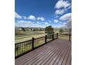 Spacious deck overlooking a lush greenbelt with walking trail offering serene views and privacy at 20670 Bridlewood Ln, Parker, CO 80138