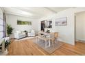 Bright dining area featuring modern furniture and hardwood floors at 1760 W 74Th Way, Denver, CO 80221