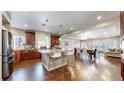 Spacious kitchen featuring modern appliances, granite countertops, and an open layout for easy entertaining at 18009 E 47Th Pl, Denver, CO 80249