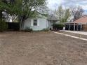 Classic single-story home with a large front yard, perfect for outdoor activities and landscaping at 3345 W Evans Ave, Denver, CO 80219