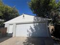 Spacious two-car garage with ample storage space and easy access, ideal for parking and projects at 3345 W Evans Ave, Denver, CO 80219