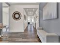 Inviting foyer with hardwood floors, neutral paint, and elegant decor at 8248 S Yantley Ct, Aurora, CO 80016