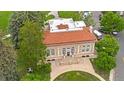 Bird's eye view of a brick building featuring a red tile roof and arched windows at 3050 W 32Nd Ave # 202C, Denver, CO 80211