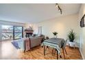 Charming living and dining area with bright natural light, modern decor, and a cozy atmosphere at 3050 W 32Nd Ave # 202C, Denver, CO 80211