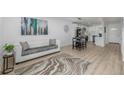 Cozy living room and kitchen area with white sofa and modern decor at 2232 Coronado Pkwy # B, Denver, CO 80229