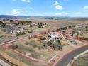 Expansive aerial view showcases the property's large lot, mountain views, and proximity to the surrounding neighborhood at 2960 High Prairie Way, Broomfield, CO 80023