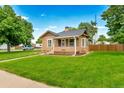 Charming home showcasing well-maintained lawn, complementing architecture, and enhancing curb appeal at 458 Cherry St, Hudson, CO 80642