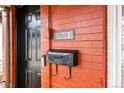 Close up of the red brick front exterior showing the front door, mail box, and address at 3632 N Marion St, Denver, CO 80205
