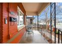 View of the charming covered front porch with room for table and chairs at 3632 N Marion St, Denver, CO 80205