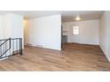 Bright living room with hardwood floors and access to kitchen at 1597 S Salem Cir, Aurora, CO 80012