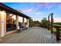 Spacious wooden deck with seating area, perfect for enjoying scenic views at 713 Aspen Rd, Golden, CO 80401