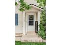 Inviting front entrance with a 'Welcome' sign, complementing the home's exterior and landscaped surroundings at 4619 S Tabor Way, Morrison, CO 80465