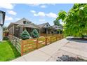 Landscaped front yard of the house highlighting its charming fence and curb appeal at 3320 N Columbine St, Denver, CO 80205