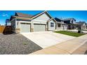 Charming home with a long concrete driveway and a two car garage at 56607 E 23Rd Ave, Strasburg, CO 80136