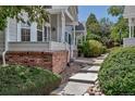 Charming home featuring a covered entrance with landscaped yard and a welcoming walkway at 4013 S Carson St # C, Aurora, CO 80014