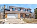 Charming two-story home with brick facade and a spacious two-car garage, perfect for Gathering living at 1456 S Jasper St, Aurora, CO 80017