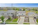 This home features a well-maintained yard in a neighborhood with easy access to open land at 17276 E 103Rd Ave, Commerce City, CO 80022
