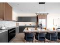 A modern kitchen featuring a large island, sleek cabinets, and stainless steel appliances at 5780 W 92 Ave, Westminster, CO 80031