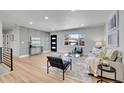 Light and airy living room, hardwood floors, and modern decor at 2681 S Newport St, Denver, CO 80224