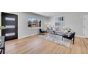 Bright living room with hardwood floors and stylish furniture at 2681 S Newport St, Denver, CO 80224