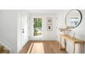 Bright entryway featuring hardwood floors, stylish decor, and ample natural light at 4131 Osage St, Denver, CO 80211
