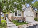 Beautiful home with stone accents and a well-manicured lawn at 6924 W Euclid Pl # A, Littleton, CO 80123