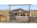 Beautiful custom home with a gated entrance and plenty of room to stretch out and enjoy the country life at 942 S County Road 129 Rd, Bennett, CO 80102