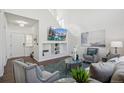 Comfortable living room with high ceilings and modern décor at 14881 E 117Th Ave, Commerce City, CO 80603