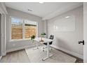 Bright home office with a large window, desk, modern lighting, and ample space for a productive work environment at 3820 Jason St # 3, Denver, CO 80211