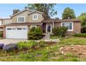 Inviting exterior showcasing a well-maintained lawn and mature landscaping at 18625 E Kent Dr, Aurora, CO 80013