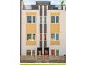 Apartment building showcasing a modern facade with bright colors and a private balcony on the top floor at 2105 S Galapago St # 4, Denver, CO 80223