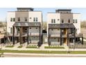 Contemporary townhomes featuring private balconies, well-maintained lawns, and modern architectural details at 2105 S Galapago St # 4, Denver, CO 80223
