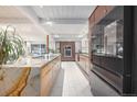 Modern kitchen with marble island and stainless steel appliances at 1398 S Fairfax St, Denver, CO 80222