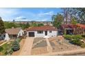 An aerial shot shows the cozy single-story home, complete with a detached garage, fenced yard, and scenic neighborhood at 716 S Osage St, Denver, CO 80223