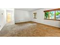 Cozy bedroom with wall to wall carpet, natural light, and ensuite bathroom at 6376 Lamar Pl, Arvada, CO 80003