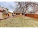 Large backyard with patio, shed, and mature trees at 4324 Eaton St, Denver, CO 80212