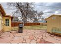 Stone patio with grill and ample space for outdoor entertaining at 4324 Eaton St, Denver, CO 80212