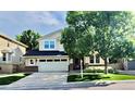 Charming two-story home features a well-maintained front yard, two-car garage, and inviting curb appeal at 5049 Heatherglen Dr, Highlands Ranch, CO 80130