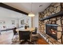 Cozy dining room with stone fireplace and hardwood floors at 709 2Nd St, Golden, CO 80403